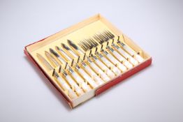 A SET OF SIX GEORGE V SILVER AND MOTHER-OF-PEARL FRUIT KNIVES AND FORKS