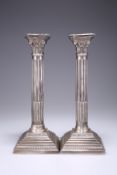 A PAIR OF CONTEMPORARY SILVER CORINTHIAN COLUMN CANDLESTICKS