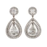 A PAIR OF DIAMOND EARRINGS