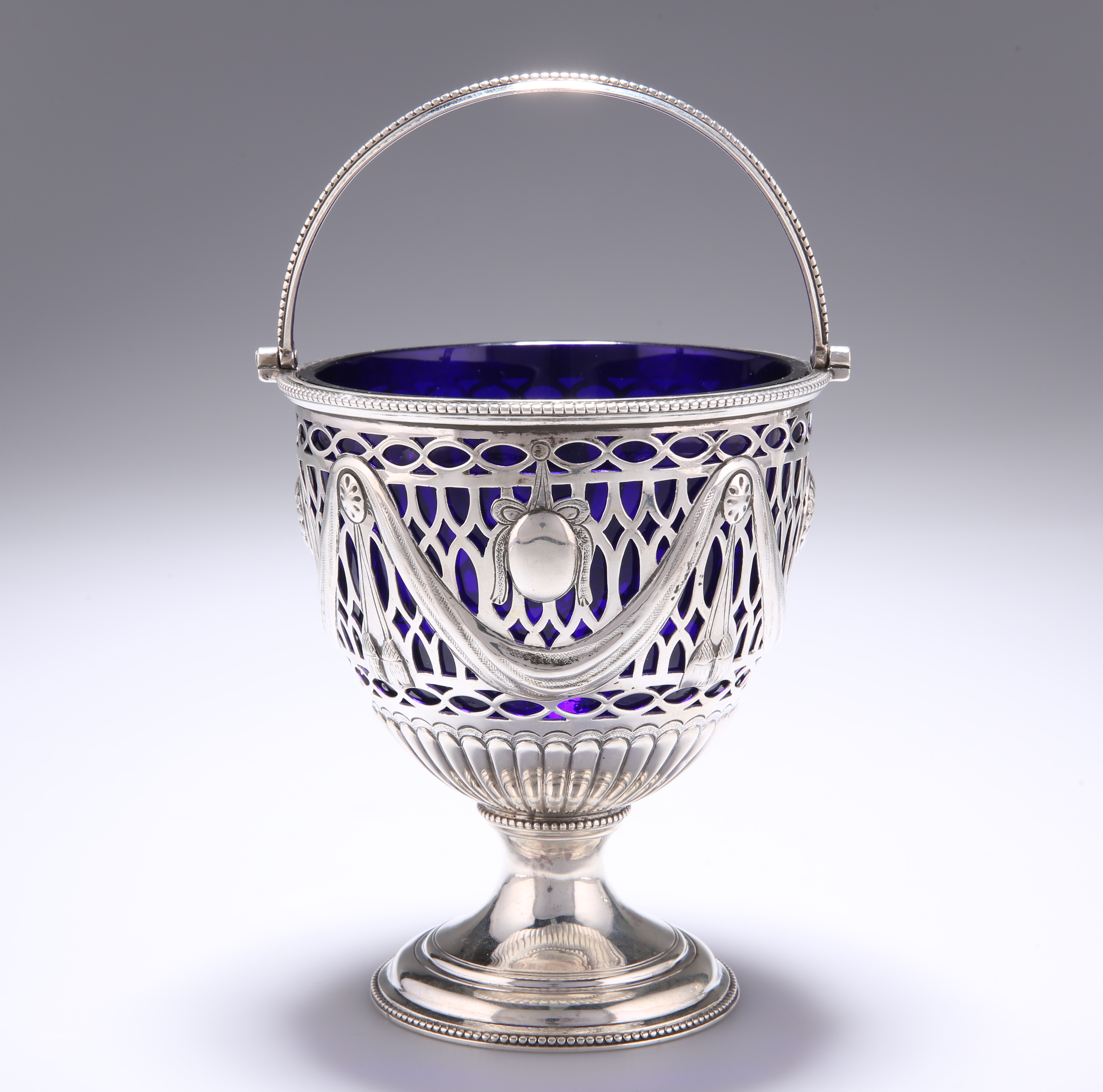 A GEORGE III SILVER SUGAR BASKET