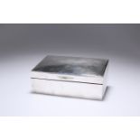 AN EDWARDIAN SILVER CIGARETTE BOX, London 1903, of rectangular form, the hinged lid engraved with