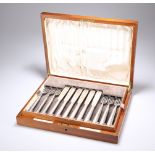 A SET OF TWELVE GEORGE V SILVER FISH KNIVES AND FORKS