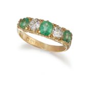 A LATE VICTORIAN 18CT EMERALD AND DIAMOND RING
