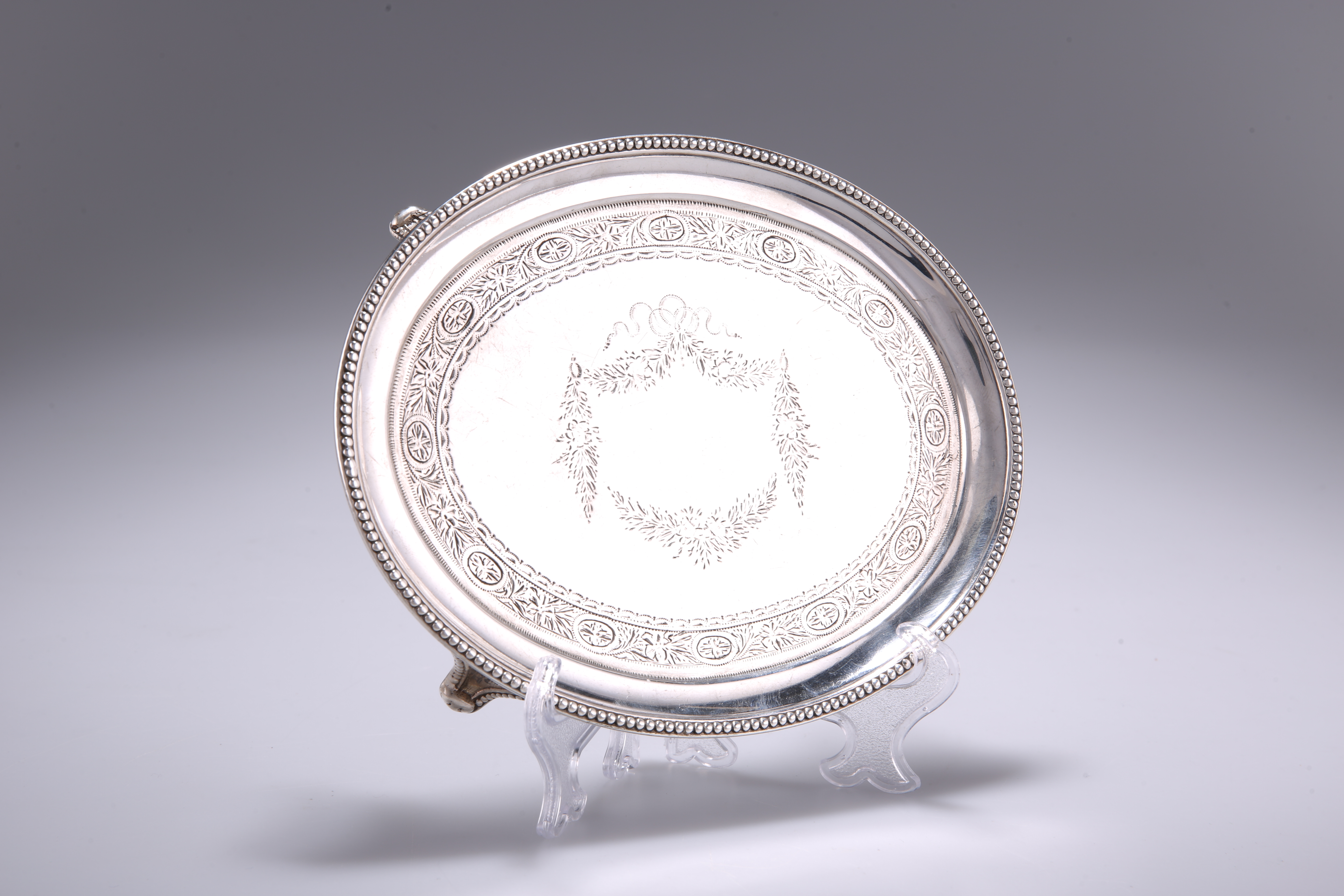A VICTORIAN OVAL SILVER TEAPOT STAND,