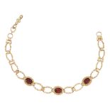 A 9CT GARNET BRACELET