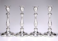 A SET OF FOUR GEORGE III SILVER CANDLESTICKS