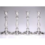 A SET OF FOUR GEORGE III SILVER CANDLESTICKS