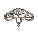 AN EARLY 20TH CENTURY DIAMOND AND PEARL BROOCH