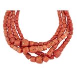 A FOUR ROW CORAL BEAD NECKLACE