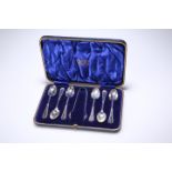 A SET OF SIX LATE VICTORIAN SILVER TEASPOONS WITH TONGS, by Isaac Ellis & Sons, Sheffield 1900, of b