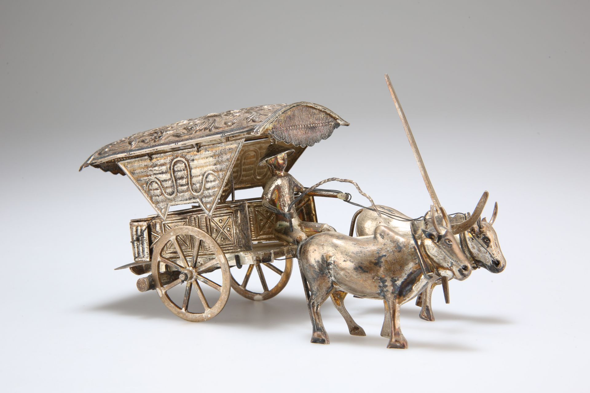 A CONTINENTAL SILVER MODEL OF A CHINESE MAN, OXEN AND CART