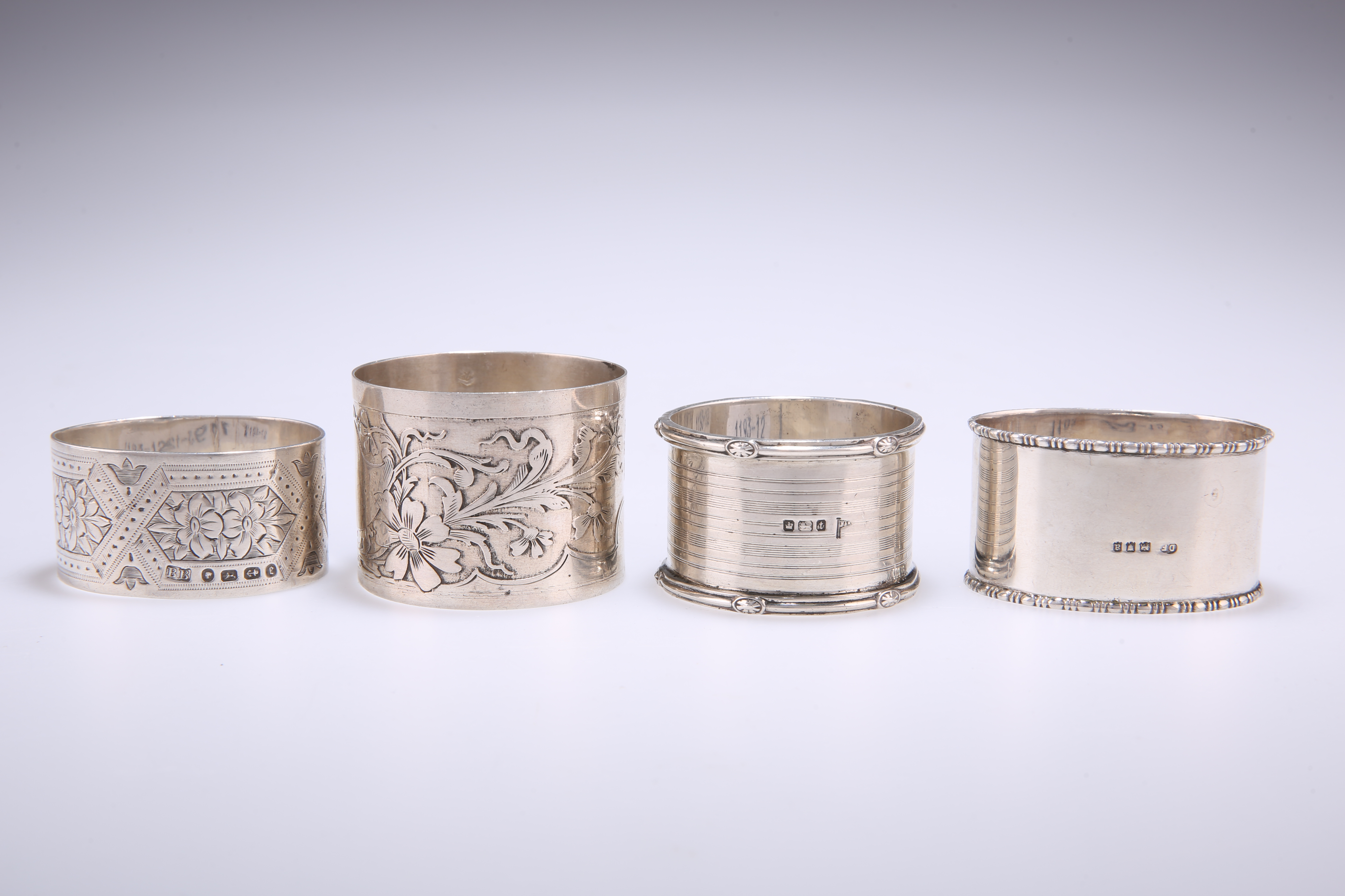A SMALL COLLECTION OF SILVER NAPKIN RINGS