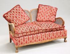 A 1930'S WALNUT BERGERE SOFA