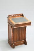 A VICTORIAN OAK DAVENPORT