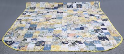 A PATCHWORK QUILT. 253cm by 212cm