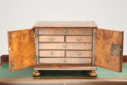 AN EARLY 17TH CENTURY WALNUT TABLE CABINET