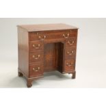 A GEORGE III OAK KNEEHOLE DESK