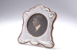 AN ART NOUVEAU SILVER-MOUNTED PHOTOGRAPH FRAME