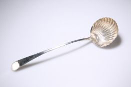 A GEORGE III SCALLOP SHELL SILVER LADLE