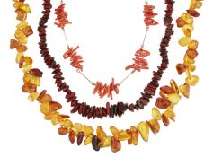 TWO AMBER NECKLACES AND A CORAL NECKLACE