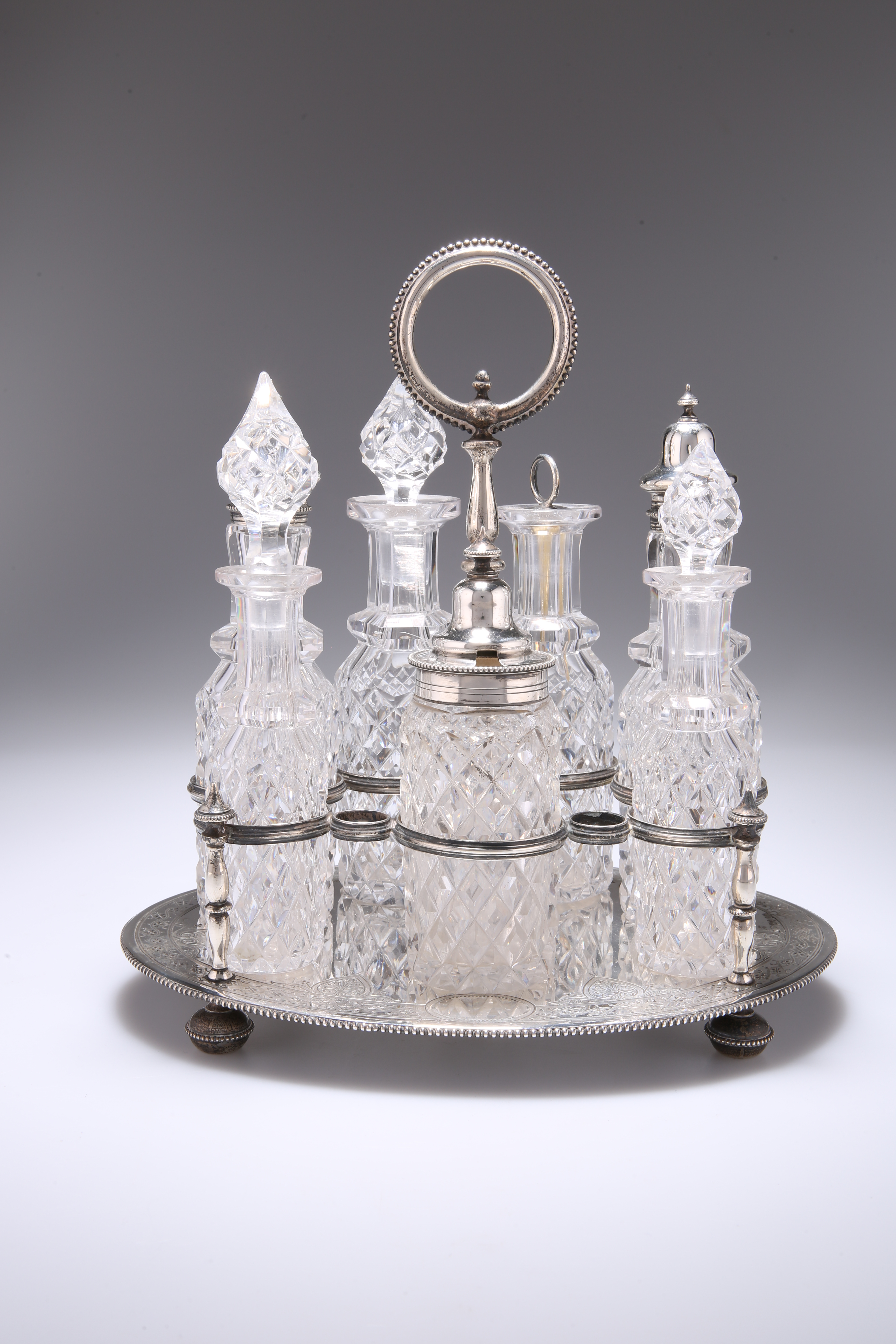 A VICTORIAN SILVER SEVEN-BOTTLE CRUET