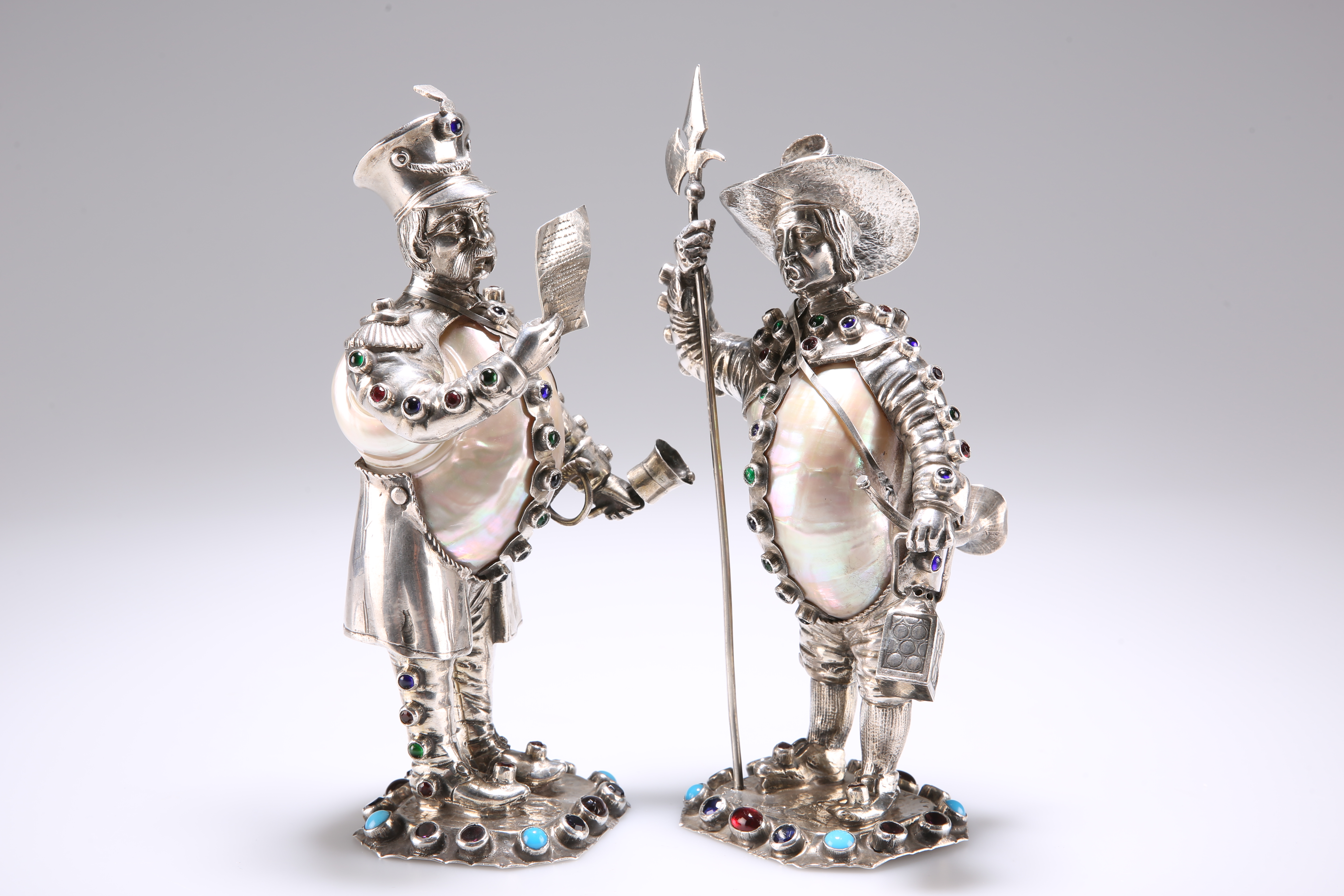 A PAIR OF GERMAN SILVER, NAUTILUS SHELL, JEWELLED AND PASTE SET FIGURES