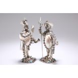 A PAIR OF GERMAN SILVER, NAUTILUS SHELL, JEWELLED AND PASTE SET FIGURES