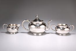 A CHINESE SILVER THREE PIECE TEA SERVICE, by Wang Hing & Co, late 19th/early 20th century, the squat
