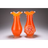 TWO GLASS VASES, each cased body with orange ground and applied with twin handles, one with
