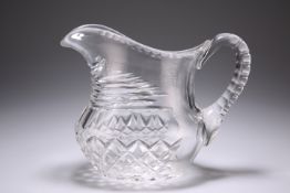 A MID-19TH CENTURY CUT-GLASS WATER JUG, boat-shaped, with hobnail cutting to the lower body. 18cm