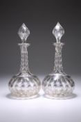 A PAIR OF CUT-GLASS DECANTERS AND STOPPERS, CIRCA 1880, of globe and shaft form, the bodies and