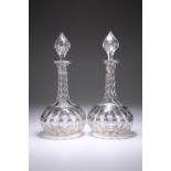 A PAIR OF CUT-GLASS DECANTERS AND STOPPERS, CIRCA 1880, of globe and shaft form, the bodies and