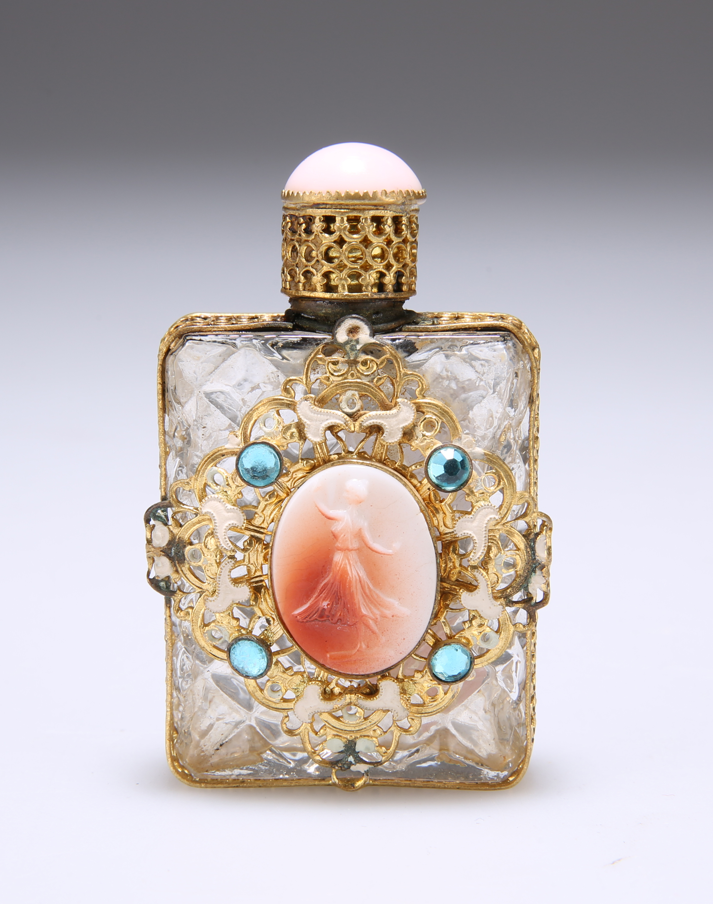 A FRENCH GILT-METAL MOUNTED AND "JEWELLED" SCENT FLASK, centred to the front with an oval plaque