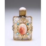 A FRENCH GILT-METAL MOUNTED AND "JEWELLED" SCENT FLASK, centred to the front with an oval plaque