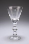 A GLASS GOBLET, with funnel bowl, engraved. 17.3cm high Provenance: The Chris Crabtree Collection,