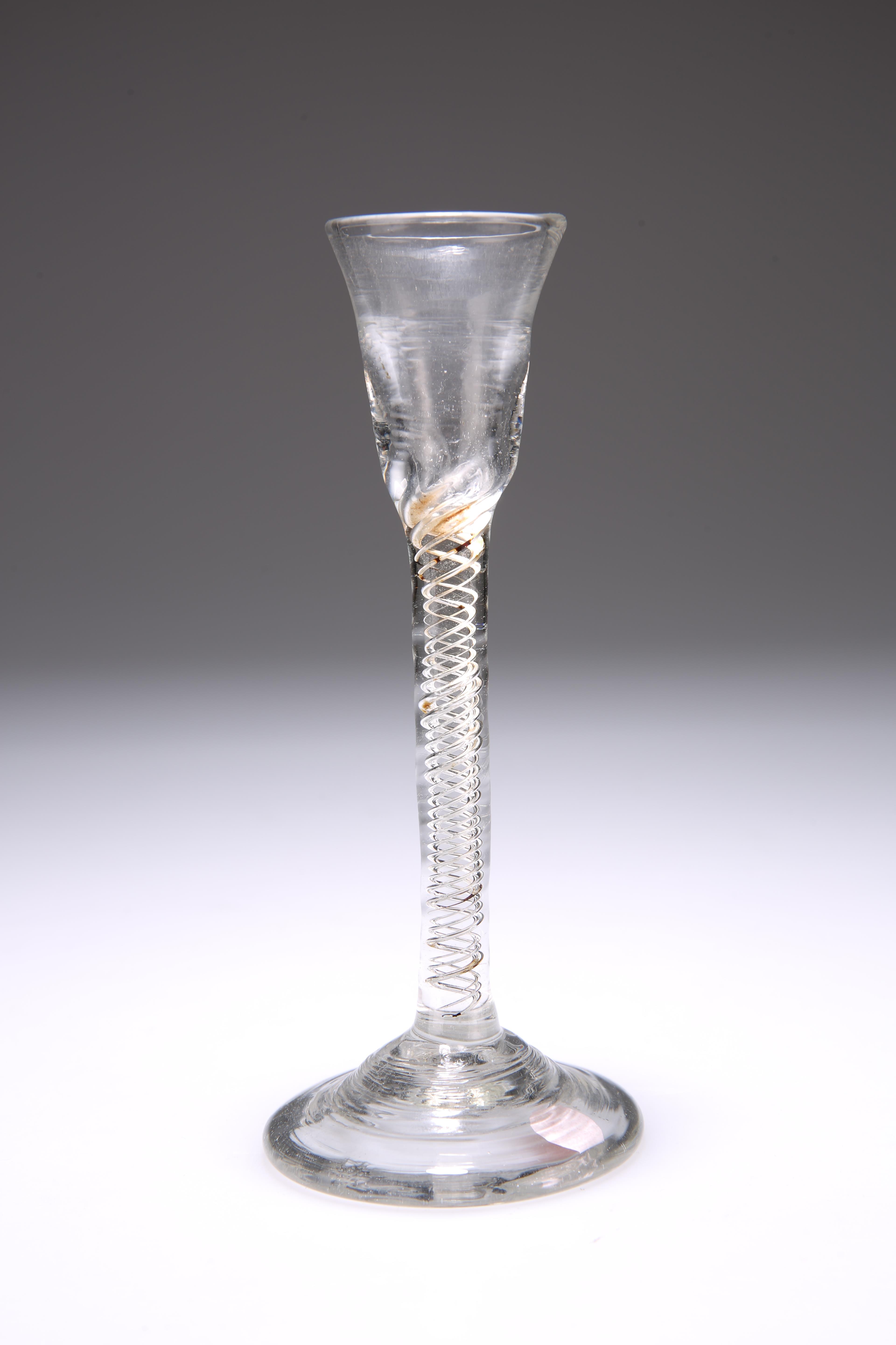 A CORDIAL GLASS, the long stem with airtwist and domed foot. 15cm Provenance: The Chris Crabtree