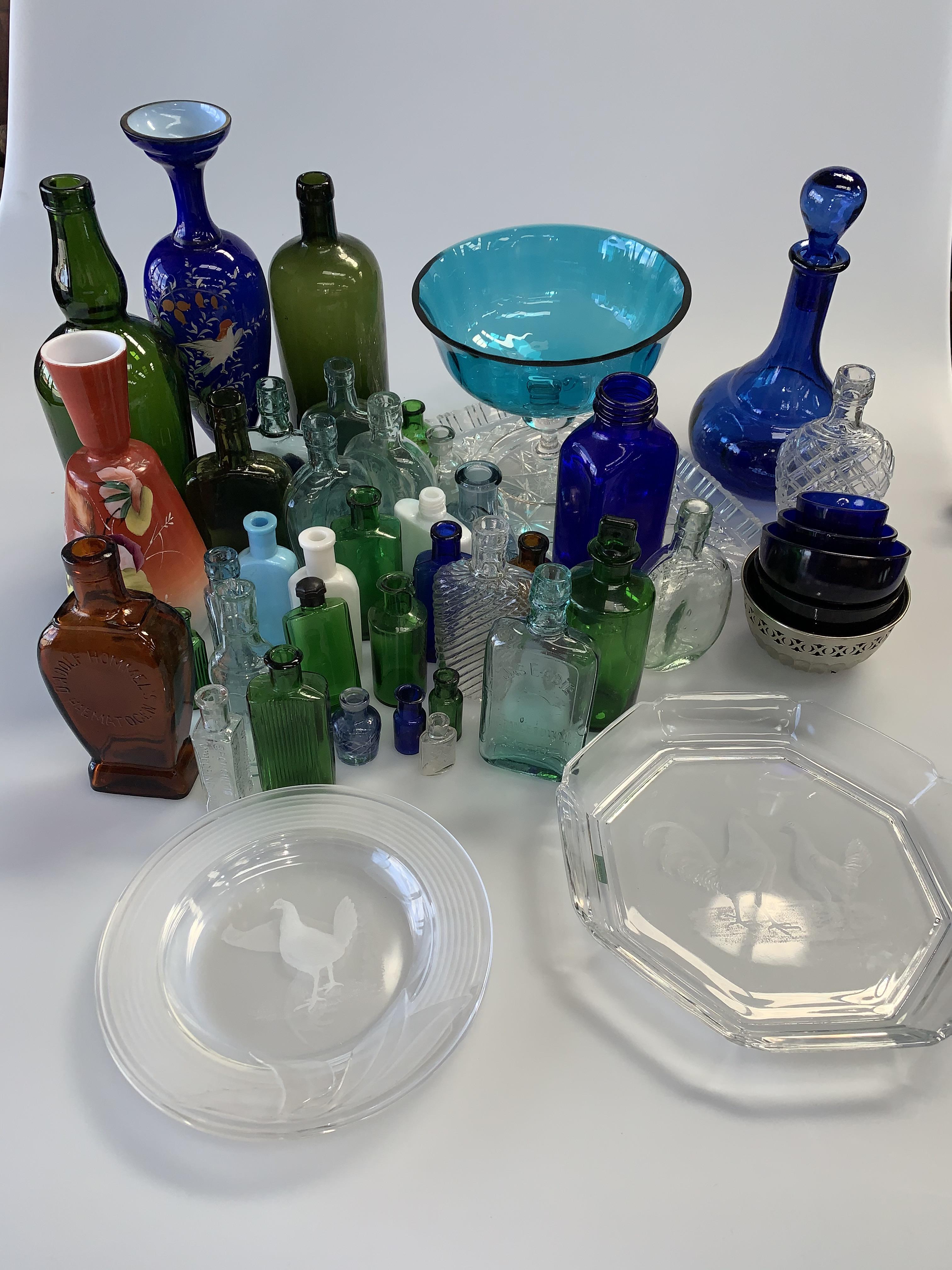 A group of glass inc. Victorian painted blue cased-glass vase, bottles, decanters, etc.