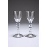 A PAIR OF GEORGIAN WINE GLASSES, CIRCA 1790, with facet-cut stems and very slightly domed plain