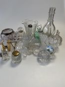 A large collection of glass inc. silver-rimmed bowl, brass-mounted cut-glass inkwell, atomiser,