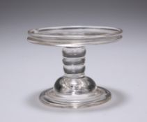 AN 18TH CENTURY GLASS PATCH STAND, the galleried circular tray raised on a knopped stem continuing