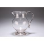 A LATE 18TH CENTURY GLASS JUG, of baluster form with reeded rim and handle with 'pinched'