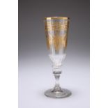 A CONTINENTAL GILDED CHAMPAGNE GLASS, PROBABLY BOHEMIAN, CIRCA 1790, the faceted tapering flute