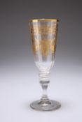 A CONTINENTAL GILDED CHAMPAGNE GLASS, PROBABLY BOHEMIAN, CIRCA 1790, the faceted tapering flute