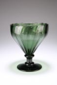 A VERY LARGE RIBBED GREEN GLASS RUMMER, 19TH CENTURY, the slightly wrythen bowl raised on a short