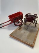 A model of an Offord Governess Cart, on a plinth base with brass plaque inscribed 'Offord