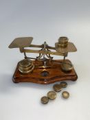 Victorian T.J. Smith Son & Co brass postal scales, on wooden plinth base, together with various