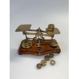 Victorian T.J. Smith Son & Co brass postal scales, on wooden plinth base, together with various
