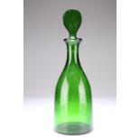 AN ENGLISH GREEN GLASS DECANTER, of mallet form, lozenge-shaped stopper. 33.5cm high Provenance: The