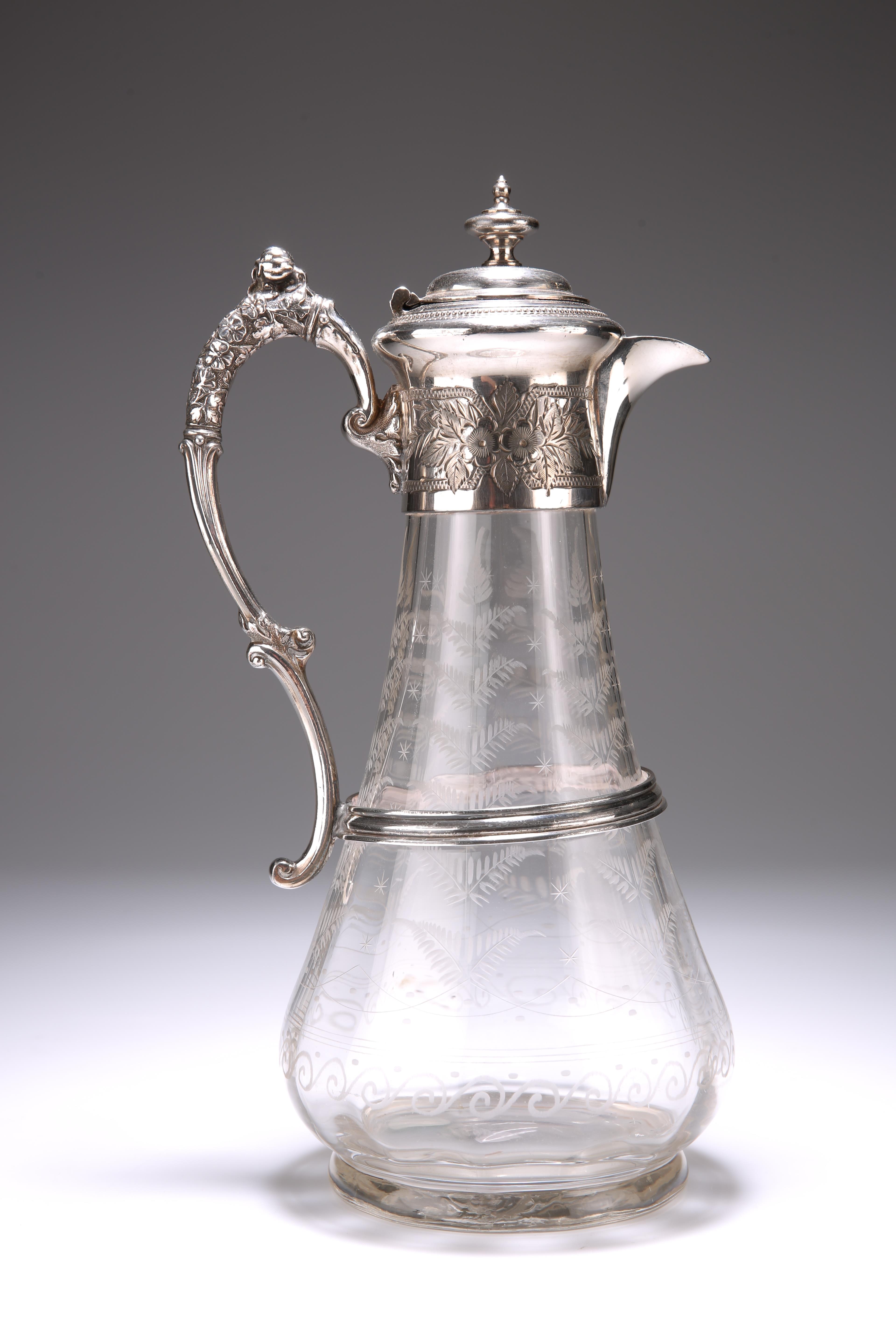 A VICTORIAN SILVER-PLATE MOUNTED CLARET JUG, the collar decorated with floral sprays, the