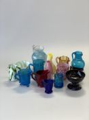 Fifteen pieces of Victorian and later glass inc. pressed coloured glass cream jugs, slag glass cream